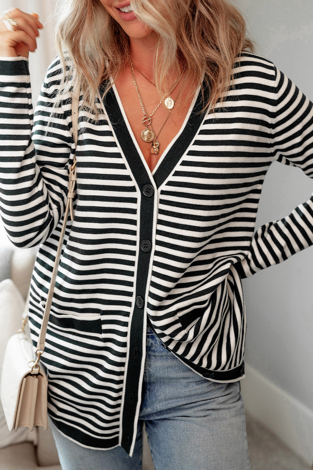 Schwarz gestreifte langarm-tunika-strickjacke