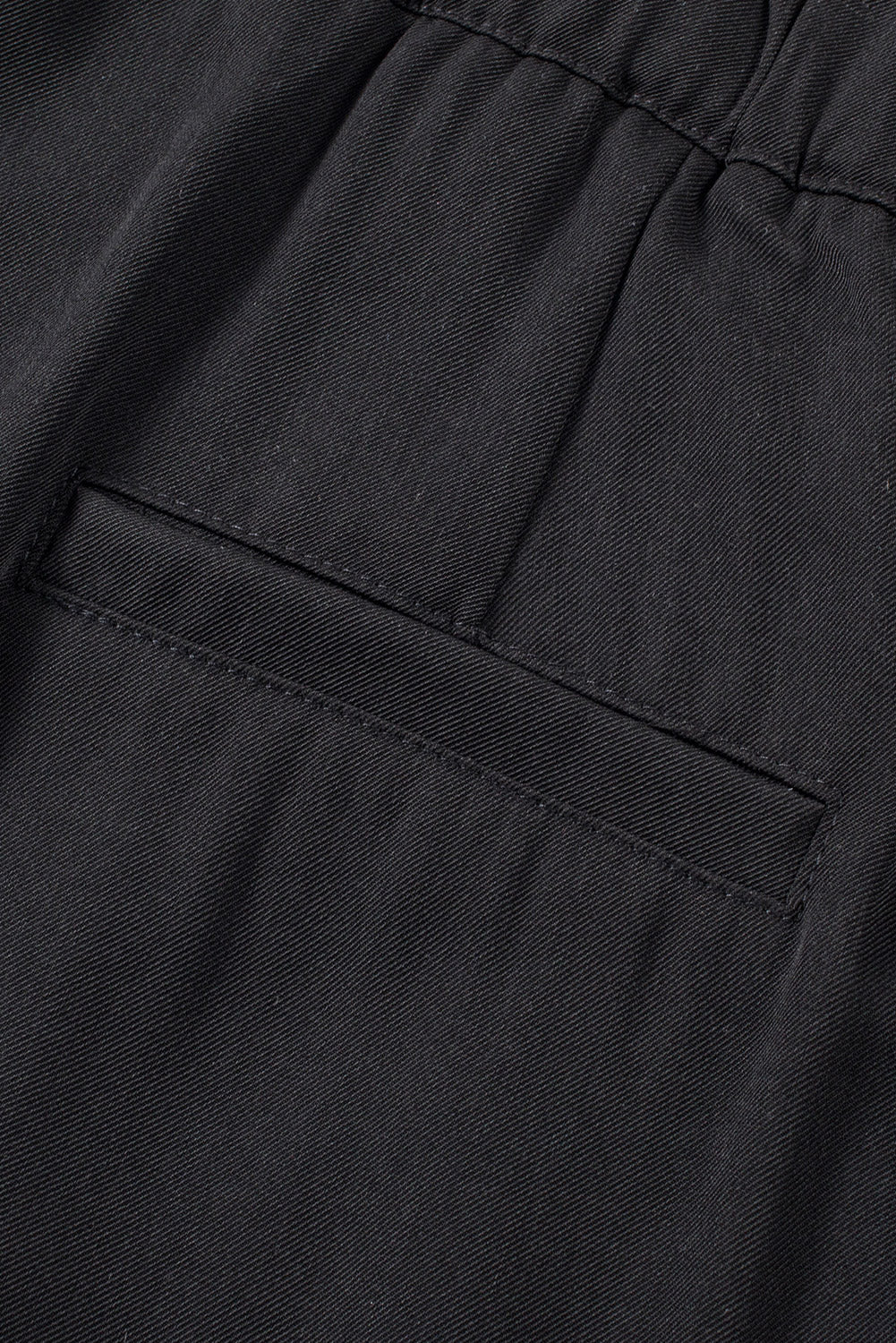 Schwarze plissierte elegante hose mit weitem bein