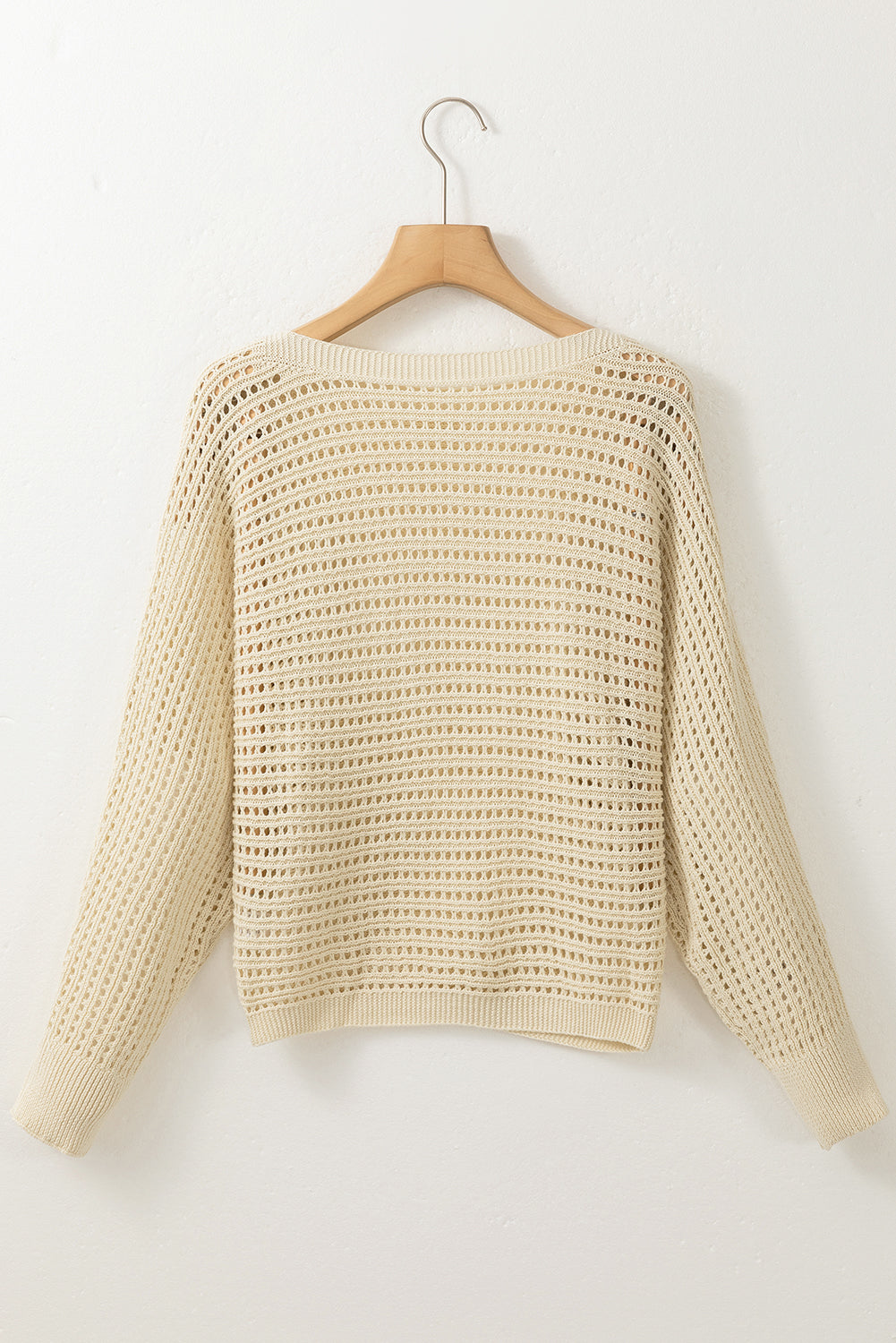Aprikosenfarbener pullover mit offenem strickband und ärmeln