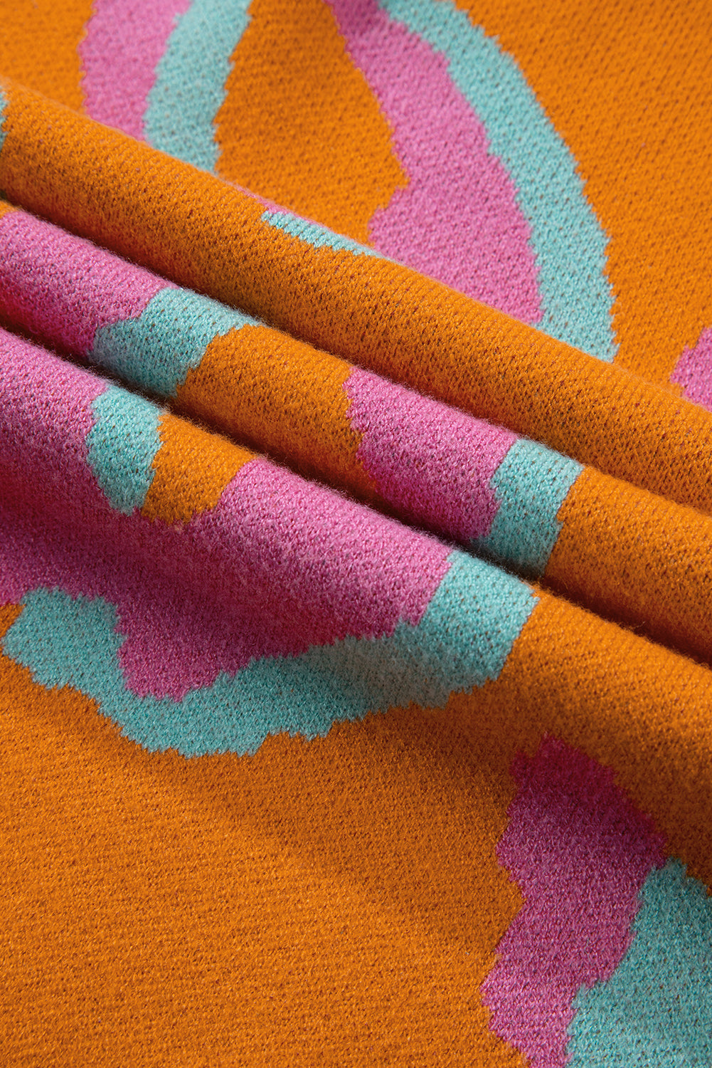 Orange leopard colorblock pullover mit geripptem rand
