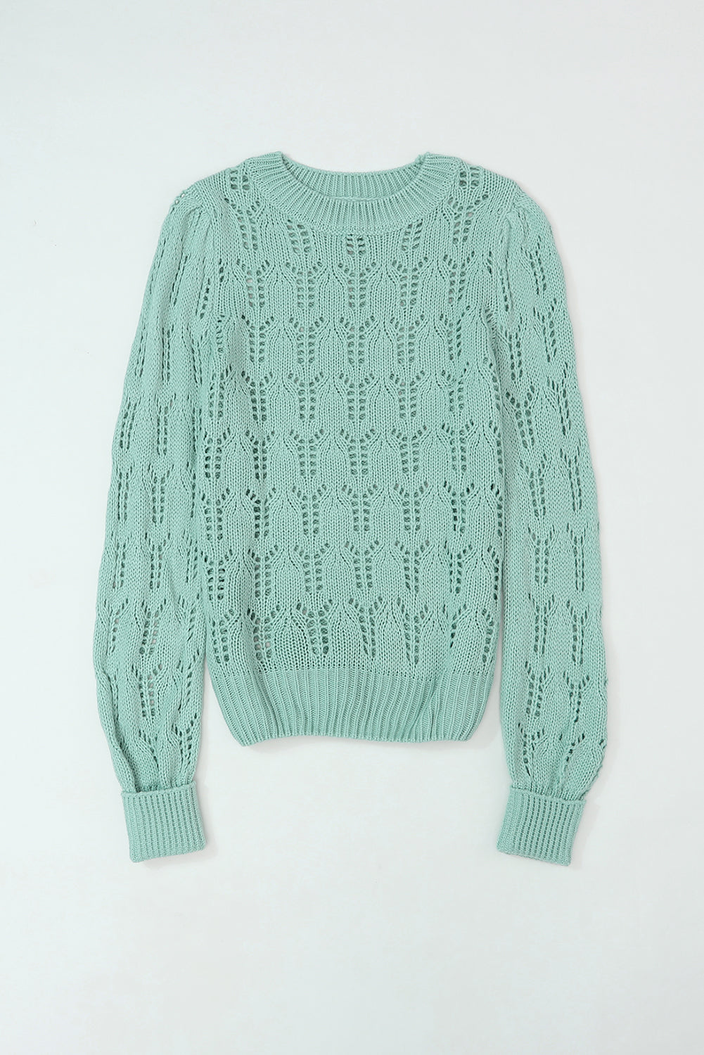 Grüner pointelle-pullover aus transparentem strick