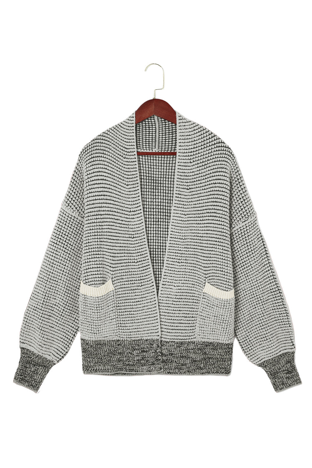 Graue strickjacke mit waffelstrick und übergroßem kragen