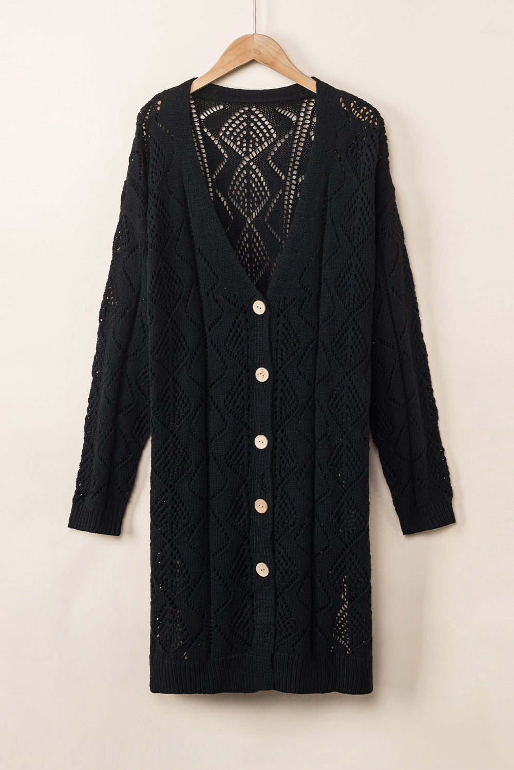 Schwarze durchbrochene strickjacke mit lochmuster