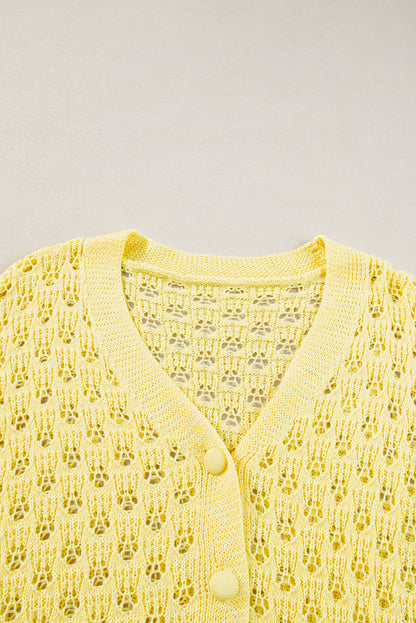 Gelber pointelle-strickpullover mit v-ausschnitt strickjacke