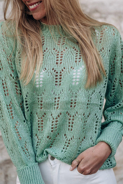 Grüner pointelle-pullover aus transparentem strick