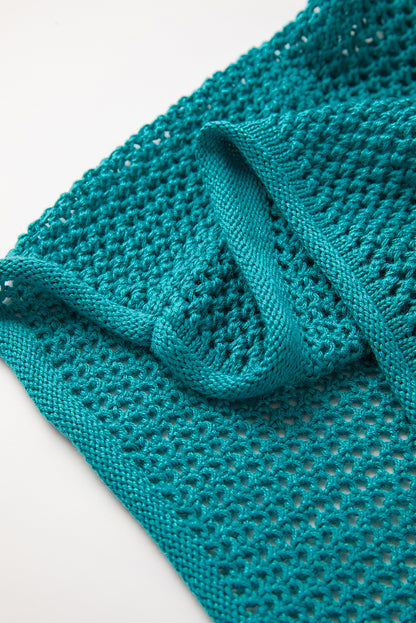Meergrüner pullover mit großer blume und hohlen schultern aus strick