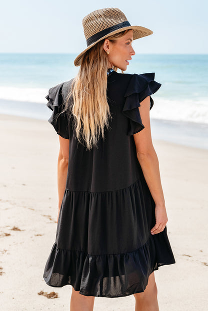 Schwarzes, mit blumen besticktes, gerafftes minikleid