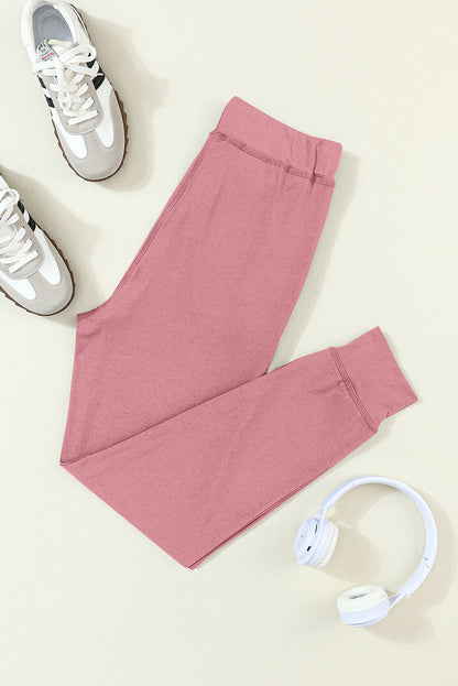 Fushia jogginghose mit kordelzug und taschenträgern