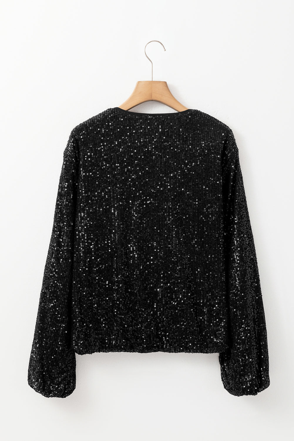 Schwarze paillettenjacke mit rundhalsausschnitt und langen ärmeln