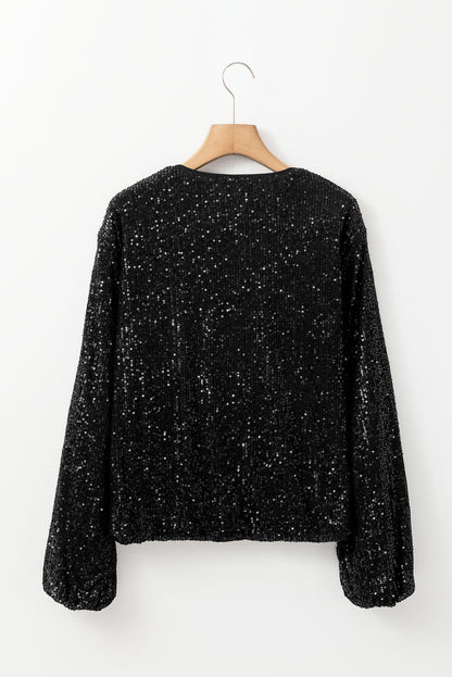 Schwarze paillettenjacke mit rundhalsausschnitt und langen ärmeln