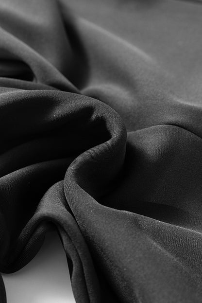 Schwarze, thermisch gefütterte hose mit geteilter schlaghose