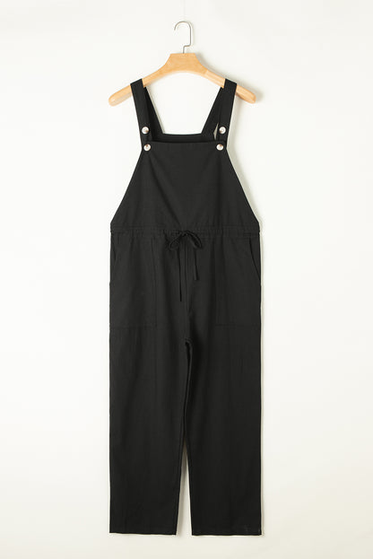 Schwarzer overall mit geknöpften riemen und kordelzug