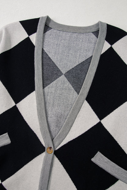 Schwarzer colorblock-cardigan mit geknöpften schultern und lockerer passform