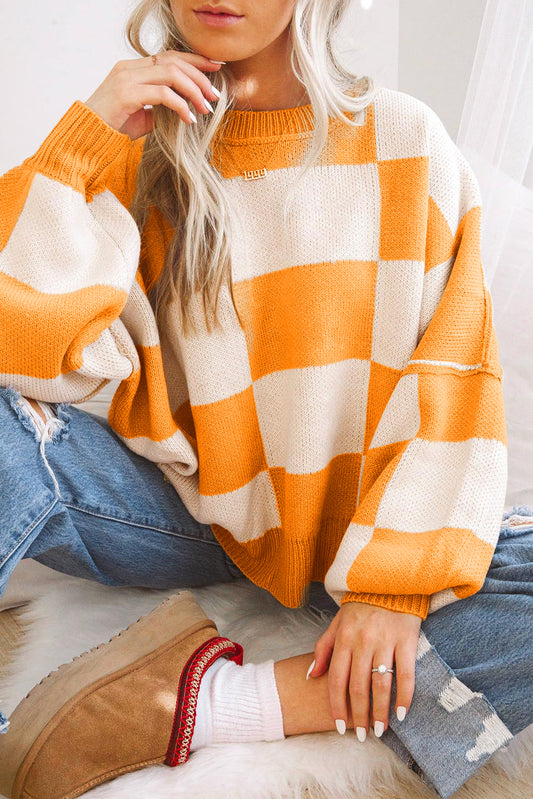 Orange karierter pullover mit läuferärmeln