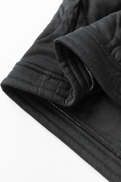 Schwarze jacke mit gestepptem druckknopf in uni-farbe