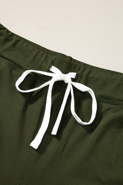 Moosgrüne jogginghose mit kordelzug an der taille