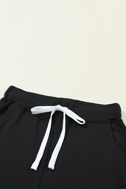 Schwarze jogginghose mit kordelzug an der taille