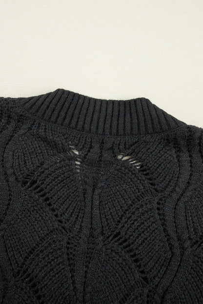 Schwarzer strickpullover mit v-ausschnitt und hohlen schultern