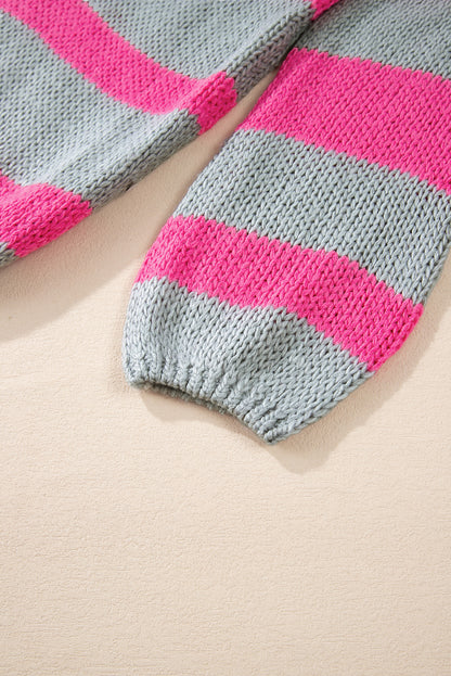 Rosa gestreifter colorblock-strickpullover mit v-ausschnitt und lockerer passform