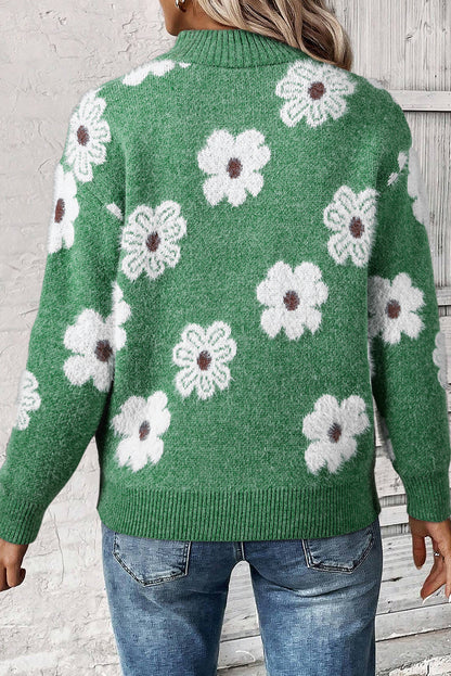 Grüner pullover mit floralem muster und halbem reißverschluss an der schulter