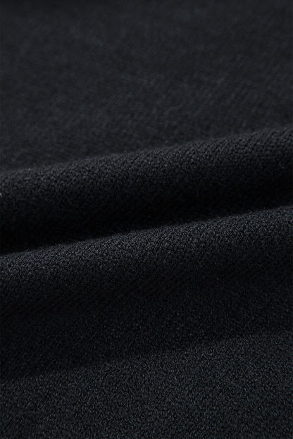Schwarzer boo strickpullover mit geripptem rand und schultern