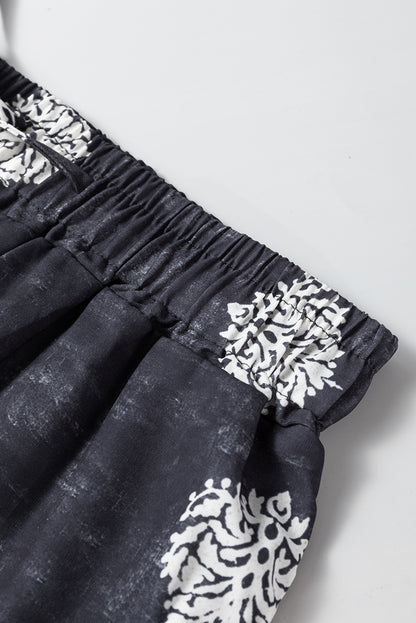 Schwarze, böhmische, bedruckte hose mit weitem bein und kordelzug