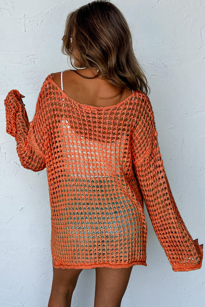 Orangefarbener tunika-pullover mit glockenärmeln und offenem häkelmuster