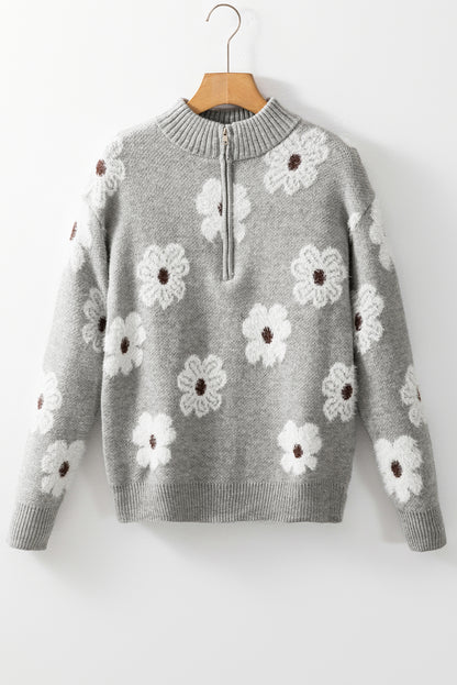 Grauer pullover mit floralem muster und halbem reißverschluss an der schulter
