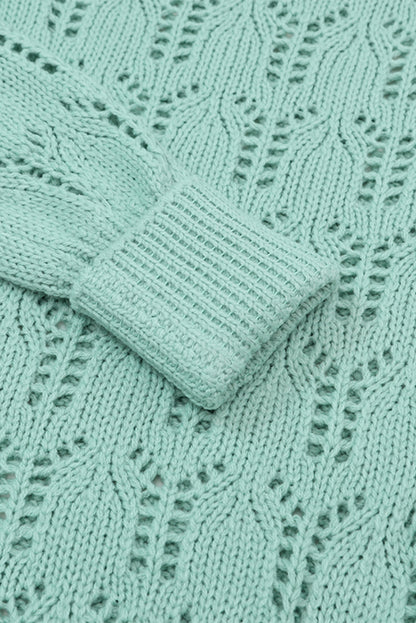 Grüner pointelle-pullover aus transparentem strick