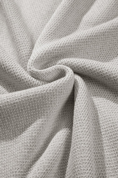 Hellgrauer quarter zip pullover mit kurzen fledermausärmeln