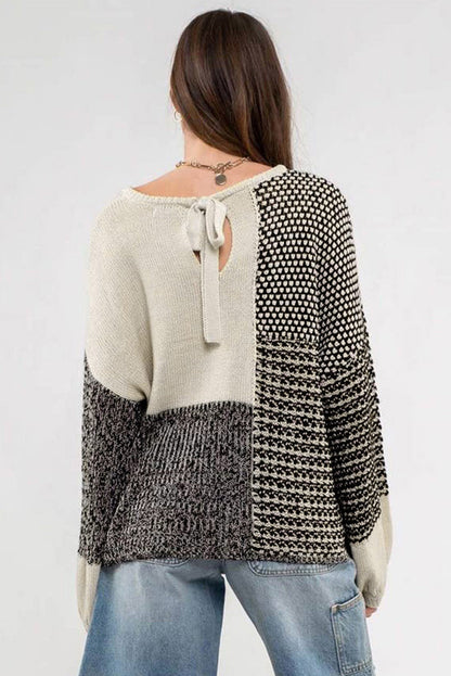 Schwarzer neutraler colorblock pullover zum binden