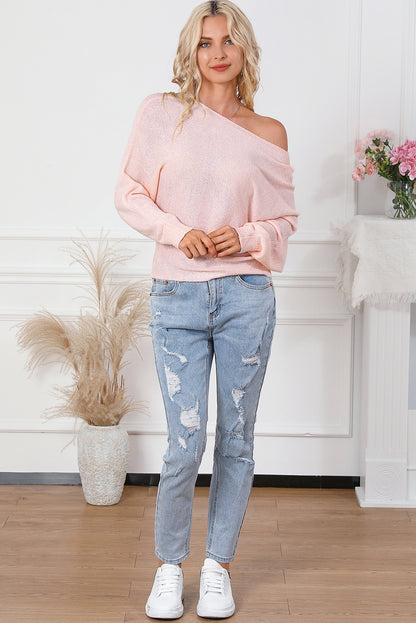 Pullover mit rosa schleifenknoten und dolman-ärmeln