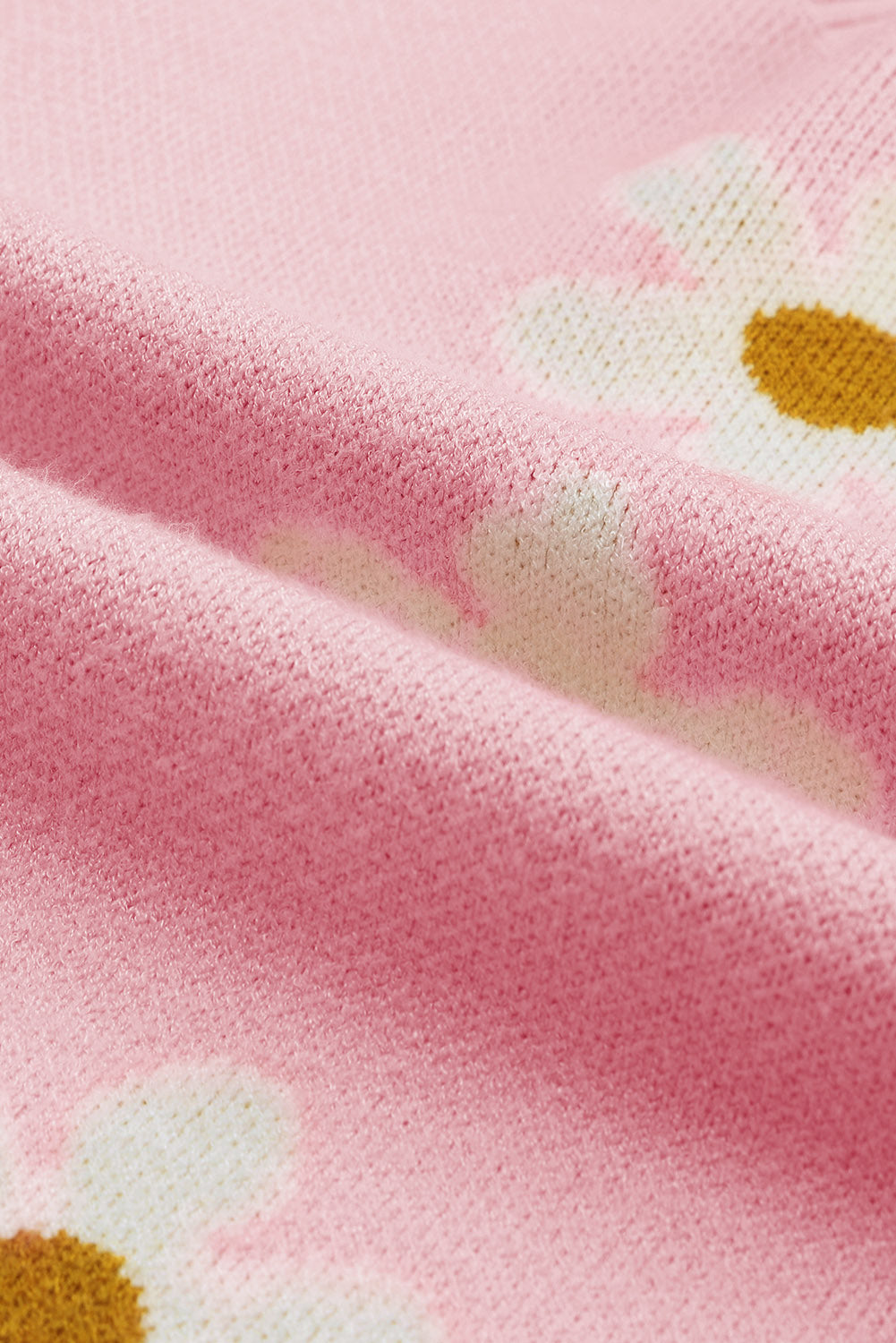 Rosa pullover mit blumenmuster und schultern