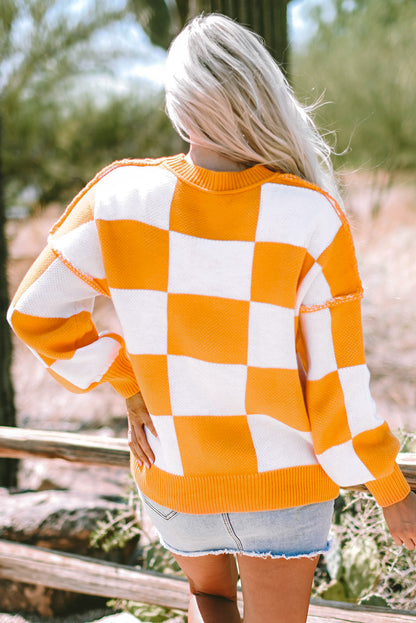 Orange karierter pullover mit läuferärmeln