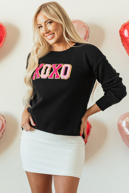 Schwarzer xoxo glitter print rundhalsausschnitt casual pullover