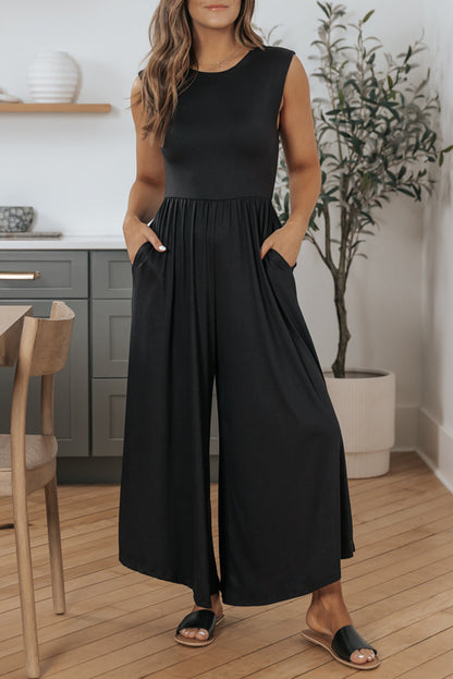 Schwarzer jumpsuit mit weitem bein und offenem rücken