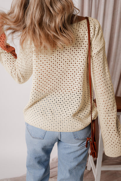 Aprikosenfarbener pointelle-strick-baggy-pullover mit farbblockmuster