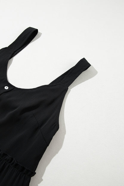 Schwarzes ärmelloses kleid mit v-ausschnitt und rüschenbesatz