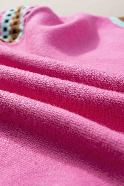 Leuchtend rosa, mit kontrast bedruckter pullover mit rundhalsausschnitt und langen ärmeln