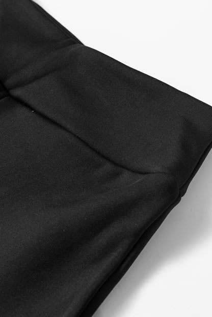 Schwarze, thermisch gefütterte hose mit geteilter schlaghose