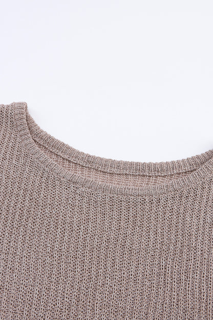 Grauer schlabberpullover mit hochgeschlossenen ärmeln