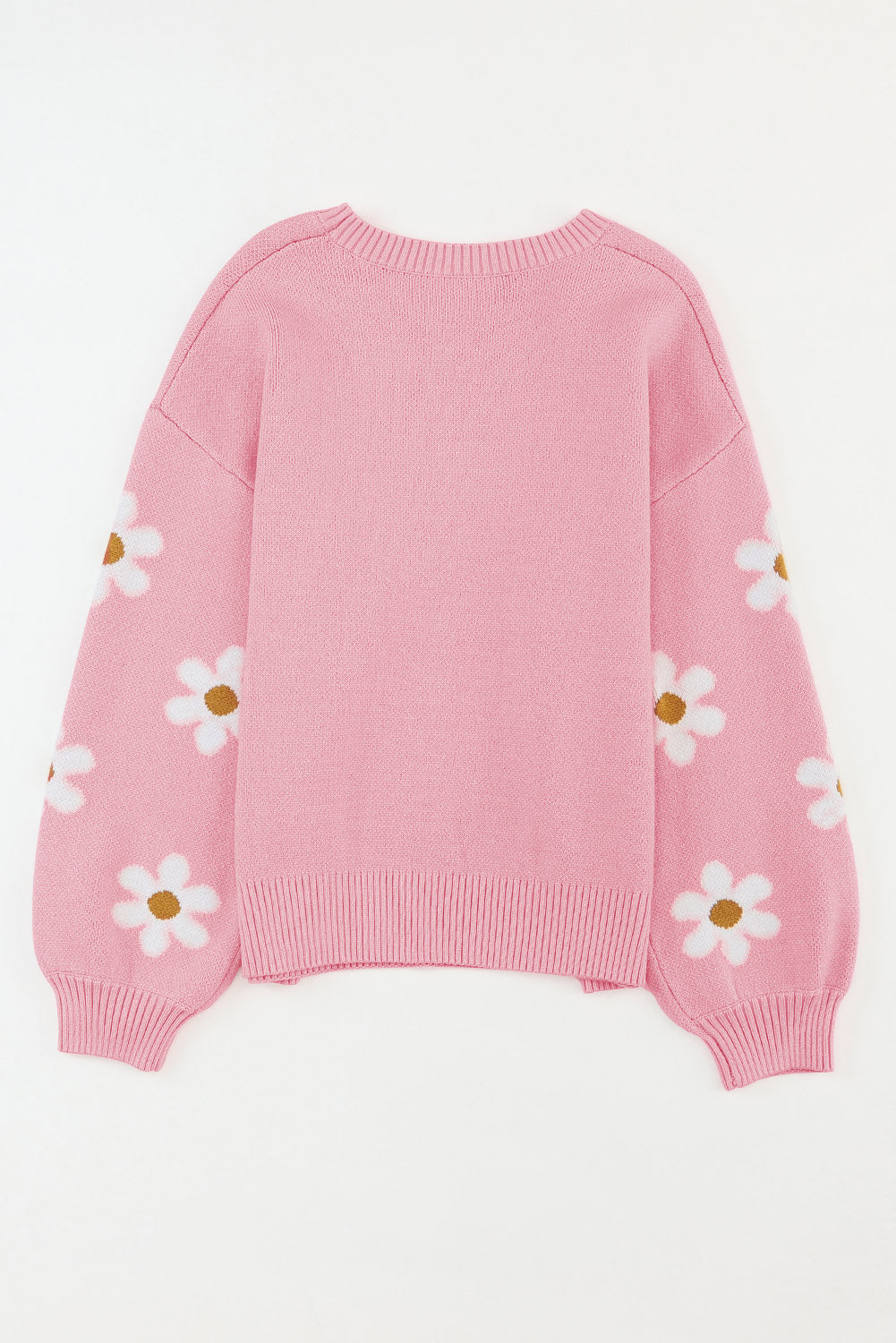 Rosa pullover mit blumenmuster und schultern