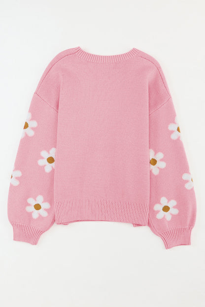 Rosa pullover mit blumenmuster und schultern