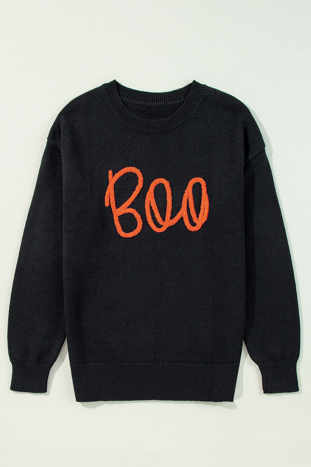 Schwarzer boo strickpullover mit geripptem rand und schultern