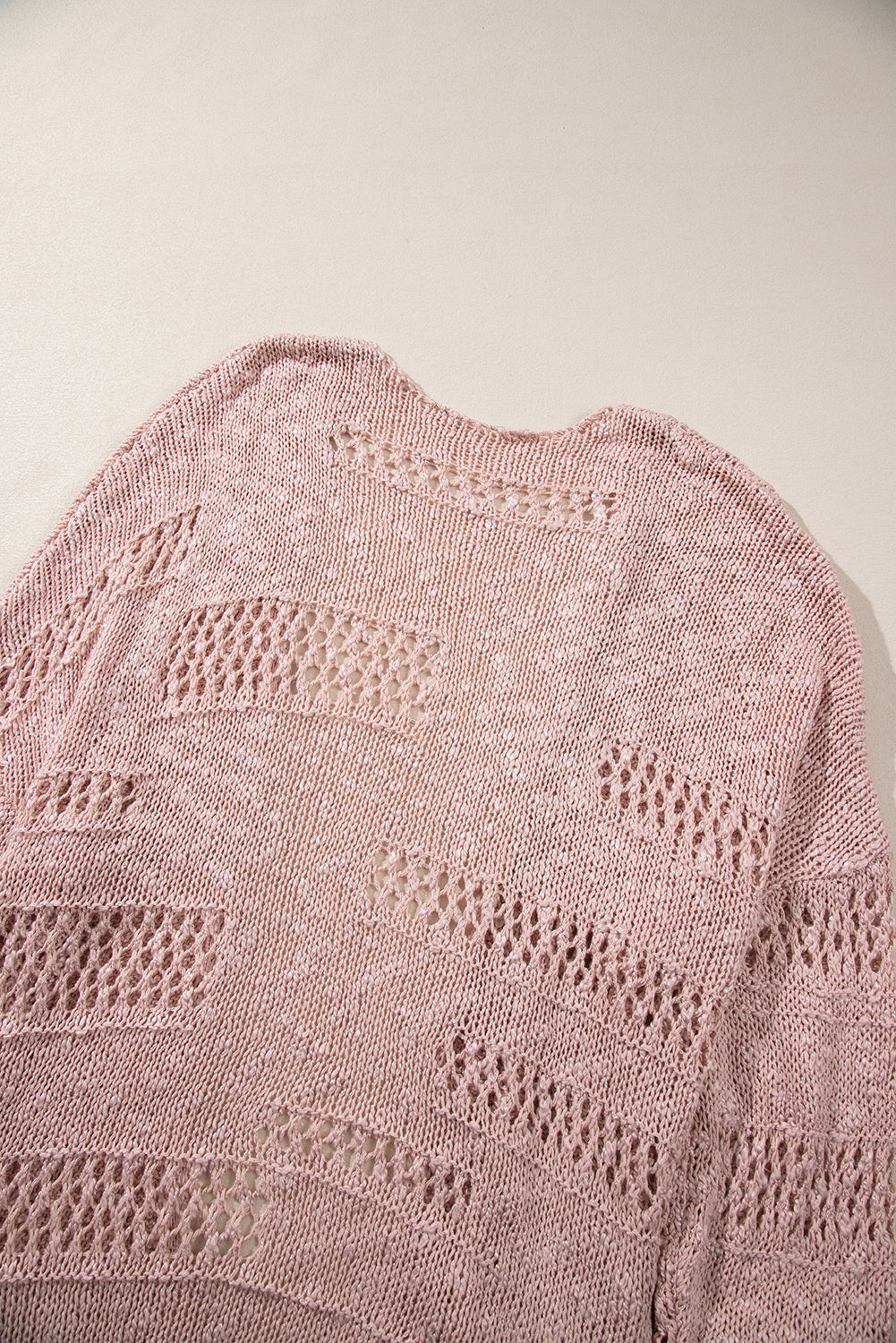 Rosa lässige strickjacke mit dolman-ärmeln und lochmuster