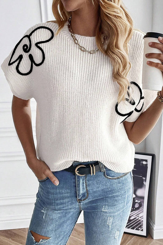 Weißes pullover-top mit blumenstickerei