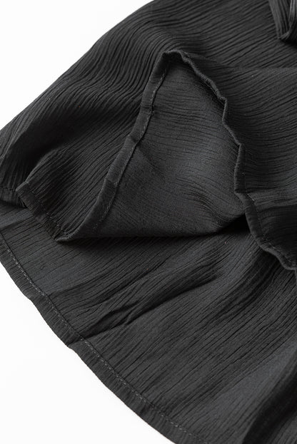 Schwarzes v-ausschnitt-schleifenknoten-ausschnitt-rüsche gestuftes maxikleid