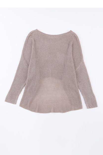 Grauer schlabberpullover mit hochgeschlossenen ärmeln