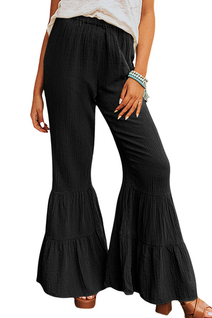 Schwarze strukturierte hose mit hoher taille und gerafftem glockenboden
