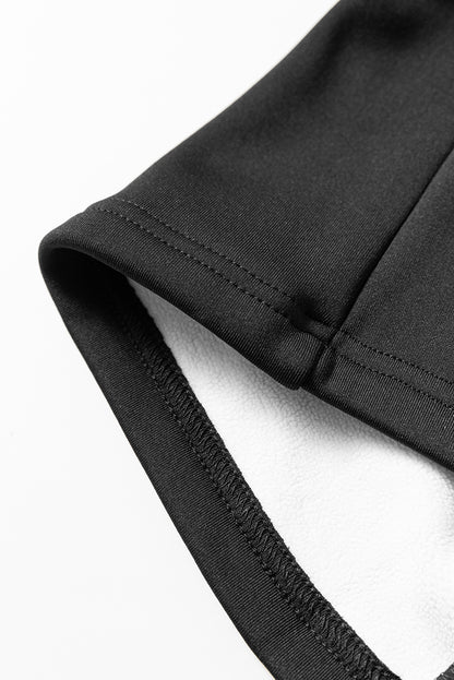 Schwarze, thermisch gefütterte hose mit geteilter schlaghose